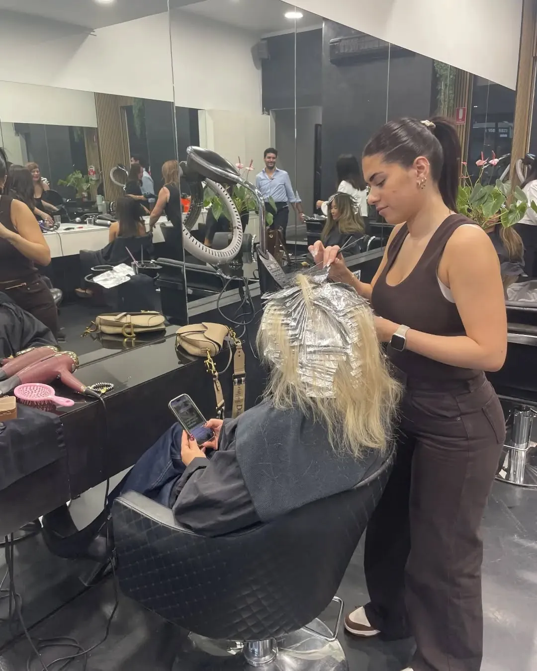 Blonde foils being placed section by section at Rokk Ebony Malvern.
