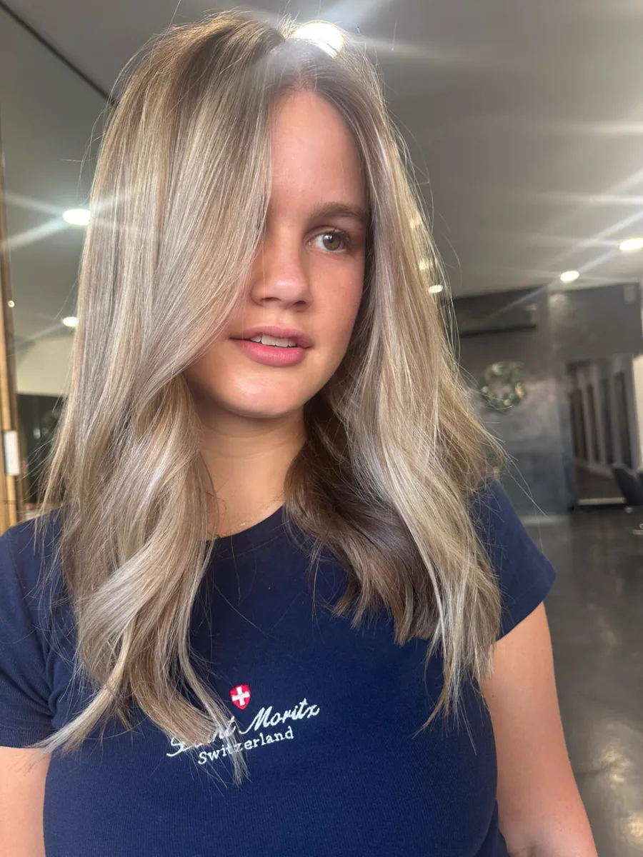 Ash blonde foils through mid-lengths and ends, Rokk Ebony Malvern.