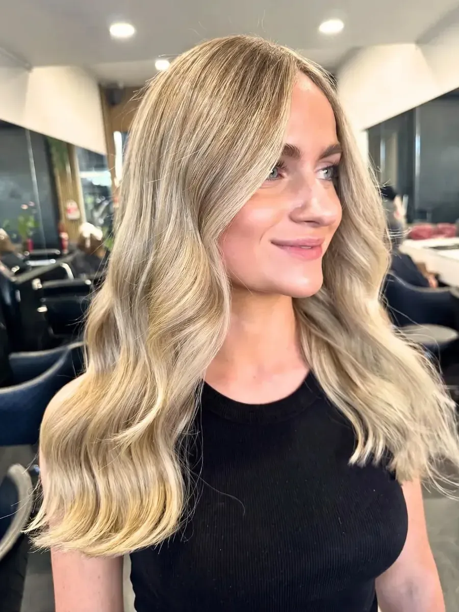 Blonde balayage with a soft wave finish, Rokk Ebony Malvern.