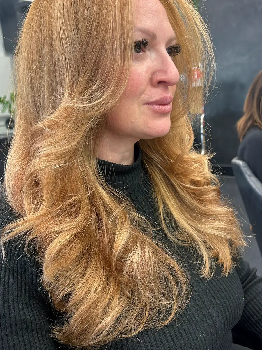 Long golden blonde finished in a full blow wave, Rokk Ebony Malvern.