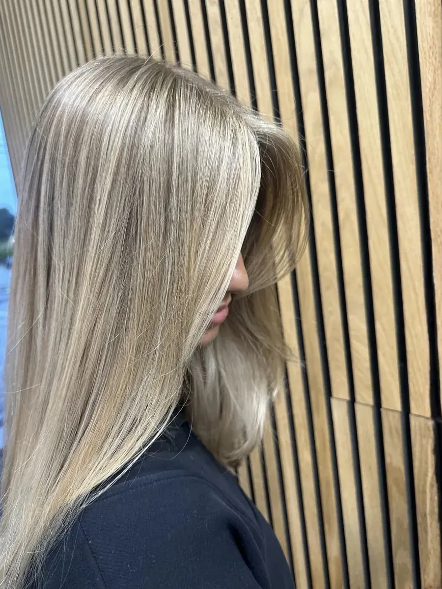 Long blonde with a sleek straight finish, Rokk Ebony Malvern.