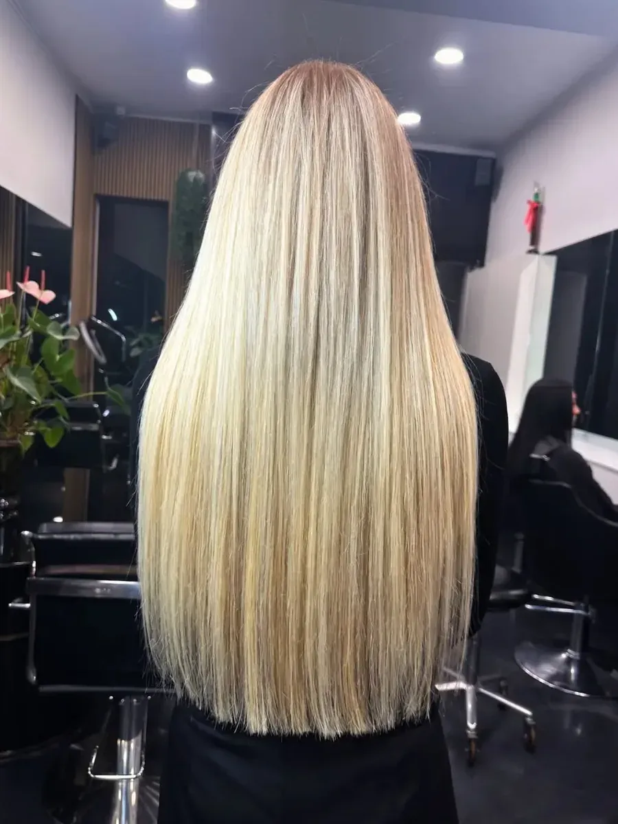 Long blonde with a sleek straight finish, Rokk Ebony Malvern.