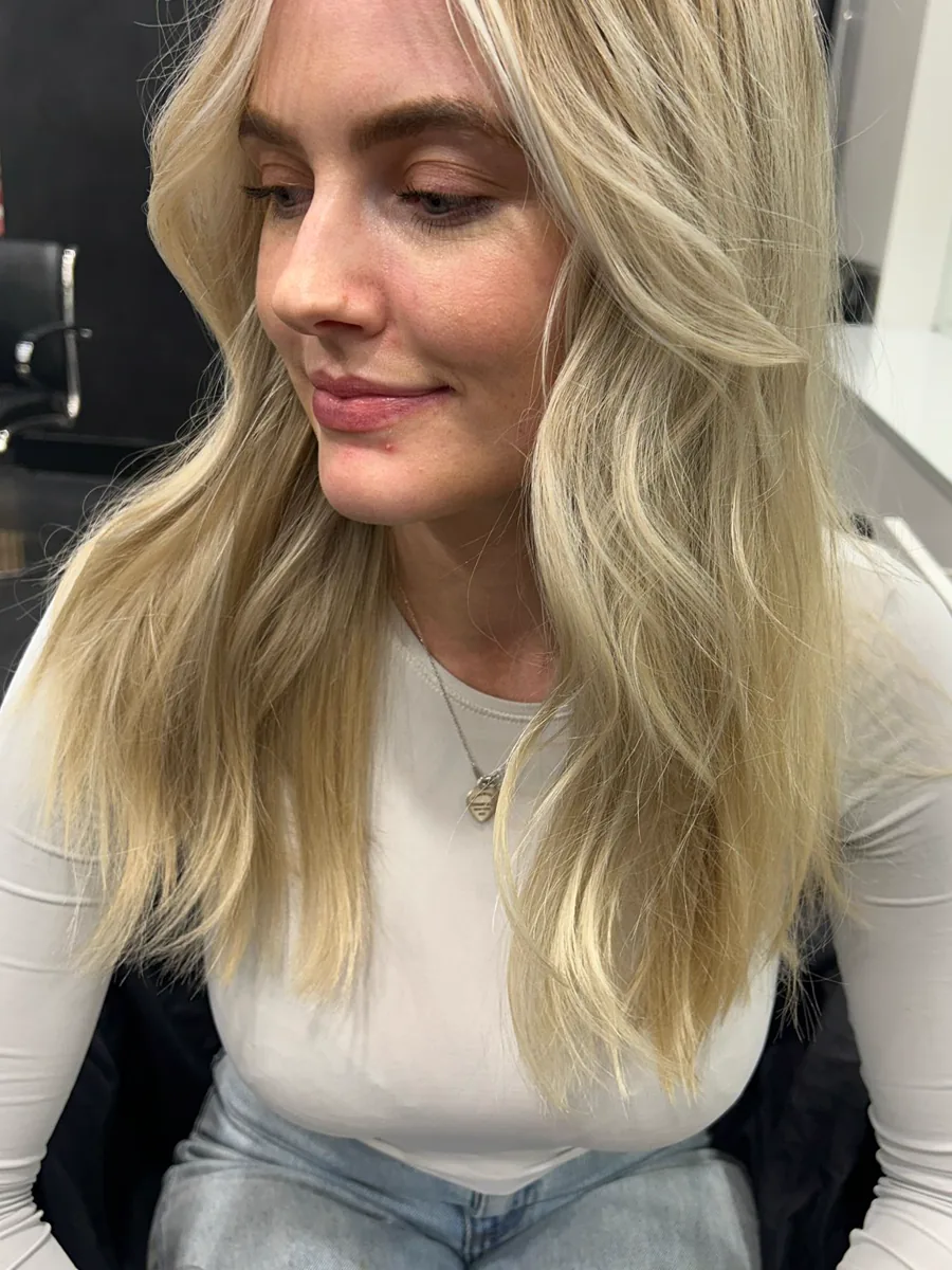 Long cool-toned blonde foils with a soft wave, Rokk Ebony Malvern.