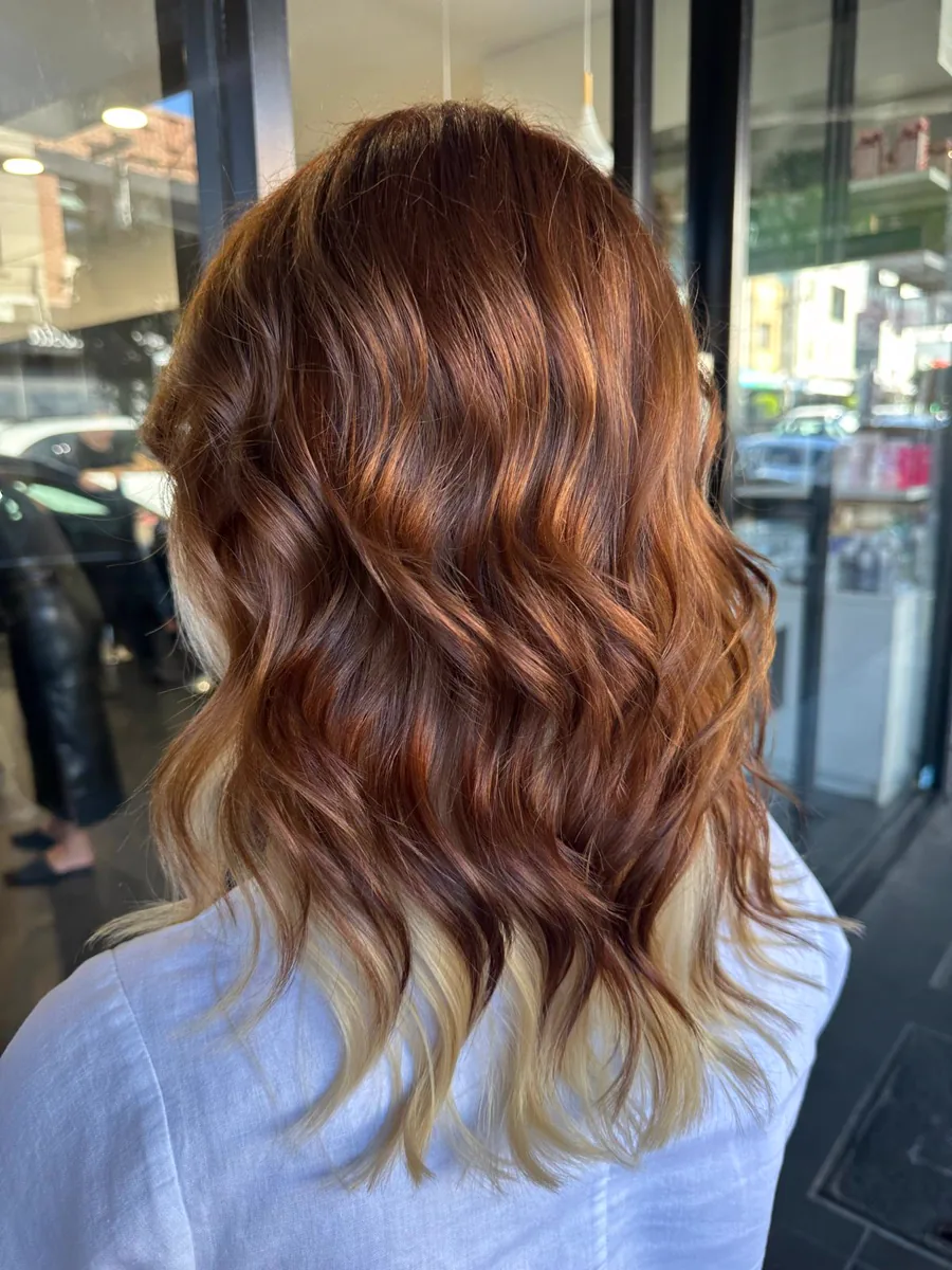 Copper hair graduating to blonde ends, seen from behind, Rokk Ebony Malvern.