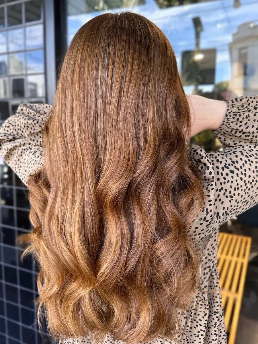 Long copper hair with a soft wave finish, Rokk Ebony Malvern.