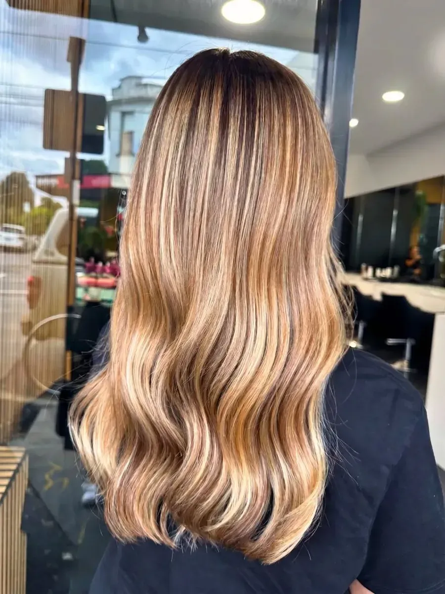 Honey blonde highlights with a deeper root, Rokk Ebony Malvern.