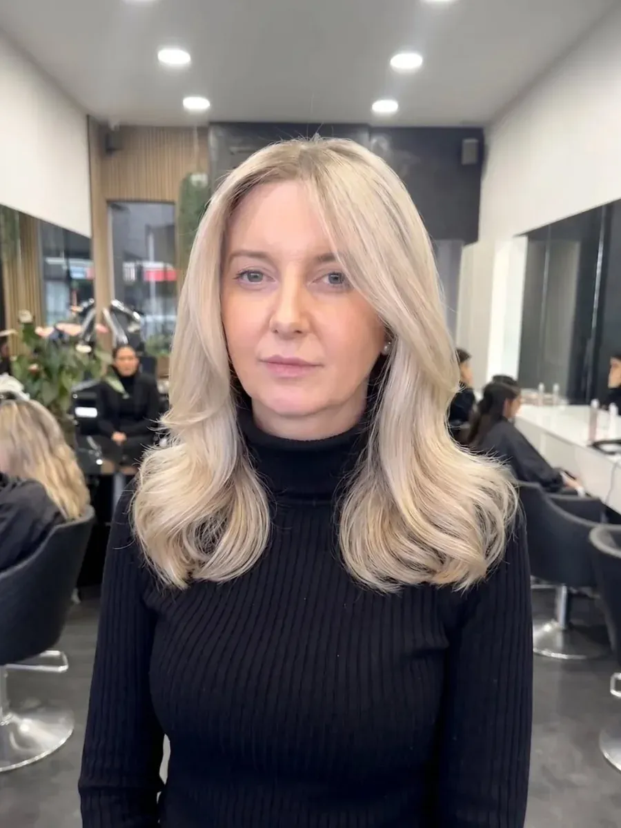 Mid-length blonde with a soft wave finish, Rokk Ebony Malvern.