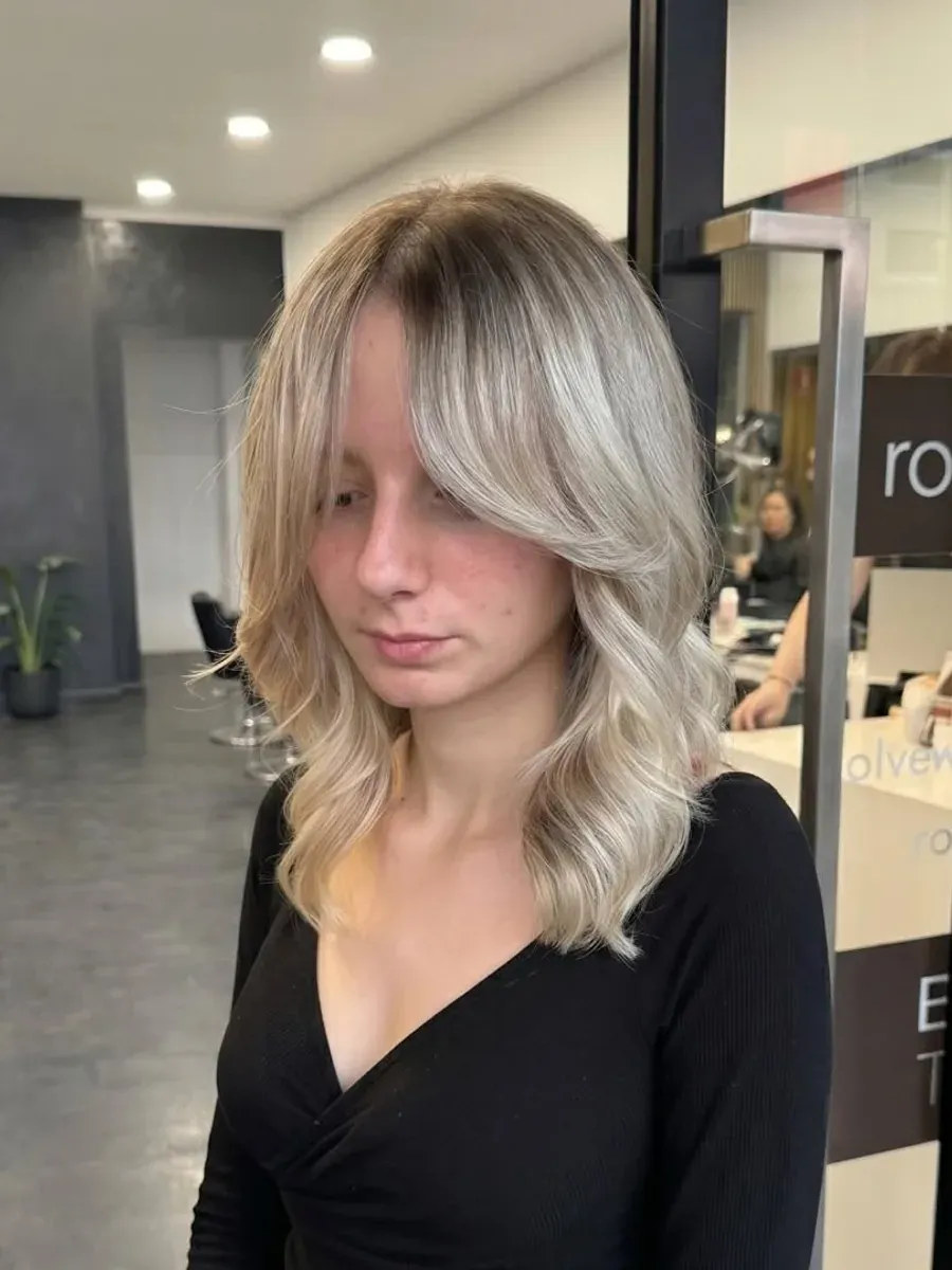 Silver blonde mid-length cut with a soft fringe, Rokk Ebony Malvern.